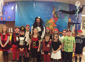 Photo of students and teacher dressed as pirates