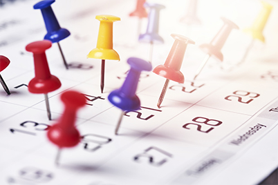 Thumbtacks in a calendar