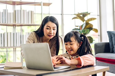 student and parent working on computer