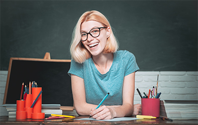Teacher smiling at her desk
